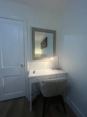a bathroom with a white sink and a mirror at Minimalist Room in Buena Park in Buena Park