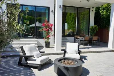 two chairs and a fire pit in front of a building at The Hollywood House in Los Angeles