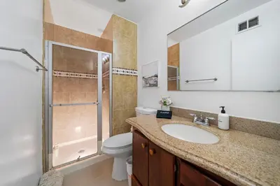 a bathroom with a sink and a toilet and a shower at Marbella Lane - Serene and Pristine 2BR Home in West Covina