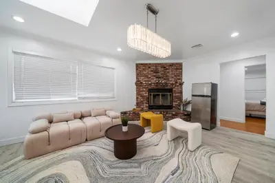 a living room with a couch and a fireplace at Marbella Lane - Serene and Pristine 2BR Home in West Covina