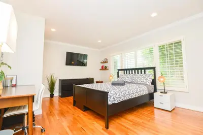 a bedroom with a bed and a desk and a computer at Large Room with Private Entrance in Beverly Hills - BRB1 in Los Angeles