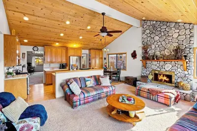 a living room with a couch and a fireplace at Lakeview Retreat - Walk to Lake, Close to Slopes in Big Bear Lake