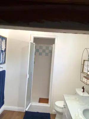 a bathroom with a toilet and a sink at LA Beach City Studio in Harbor City