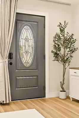 a grey door with a stained glass window at Lyn's Stay in Westminster