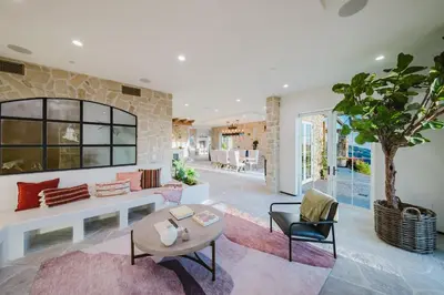 a living room with a couch and a table at Mintcello Estate in Malibu