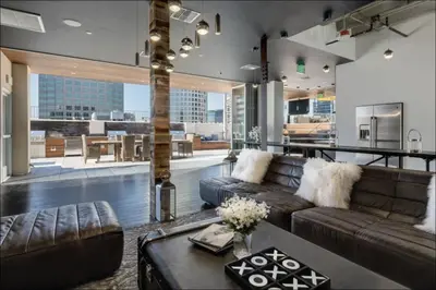a living room with a couch and a table at Furnished Studio Apartment in Los Angeles