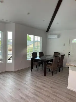a dining room with a table and chairs at 530 sq ft Mini House in Walnut in Walnut