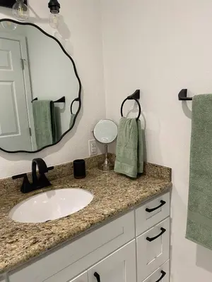 a bathroom with a sink and a mirror at 530 sq ft Mini House in Walnut in Walnut
