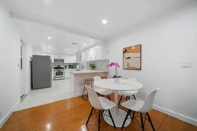 a kitchen and dining room with a table and chairs at Marbella Lane - Serene & Spacious 3BR Haven in West Covina