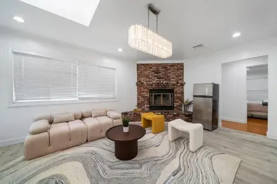 a living room with a couch and a fireplace at Marbella Lane - Your Cozy Haven 2BR Retreat in West Covina