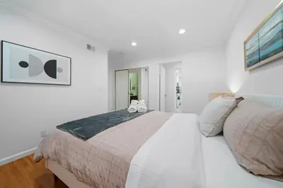 a white bedroom with a large bed in it at Marbella Lane - Your Cozy Haven 2BR Retreat in West Covina