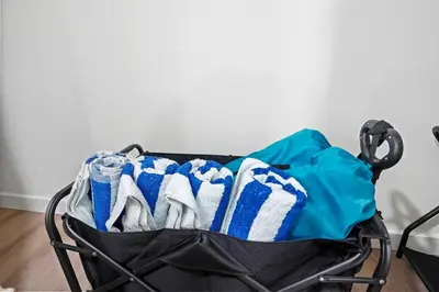 a shopping cart filled with clothes and shoes at 1 mile from the Beach Fire Pit, Patio, Parking! in Long Beach