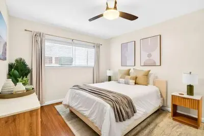 a white bedroom with a bed and a ceiling fan at Prime Manhattan Beach 2BR Walk to Beach with Parking in Manhattan Beach