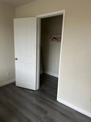an empty room with a white door and a closet at Big quiet bedroom in Hacienda Heights
