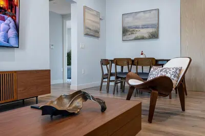a living room with a dog statue on the floor at Brand New 2BR Loft near Universal & Hollywood in Los Angeles