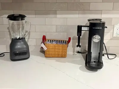 a blender sitting on a counter next to a basket at Welcome To The Modern Casita Riverside! in Riverside