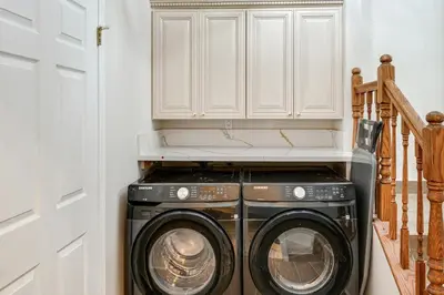 a washer and dryer in a laundry room at Games Galore! Pine Mountain Club Retreat Near Town in Pine Mountain Club