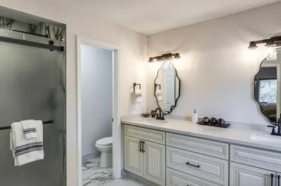 a bathroom with a sink and a mirror at Games Galore! Pine Mountain Club Retreat Near Town in Pine Mountain Club
