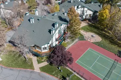 an overhead view of a large house with a tennis court at Lakeview Getaway Game Rm, Pool, Spa, Sauna! in Big Bear Lake