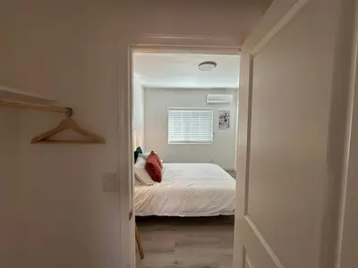 a small bedroom with a bed and a window at Brand New Muji Style 3B3B Retreat with Courtyard in Walnut