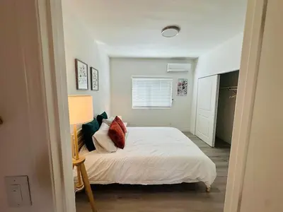 a bedroom with a white bed and a window at Brand New Muji Style 3B3B Retreat with Courtyard in Walnut