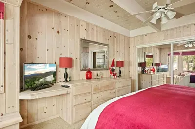a bedroom with a large bed and a television at Home Sweet Home in Big Bear Lake