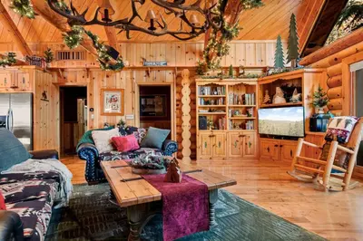 a living room with a couch and a table at Honeycomb Hideaway in Big Bear Lake