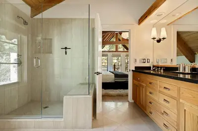 a bathroom with a shower with a glass shower backdoor at Seuss by the Shore in Big Bear Lake