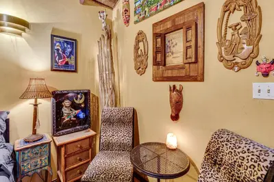 a room with a couch and a table with a tv at 2 Mi to Echo Park Funky Silver Lake Studio in Los Angeles