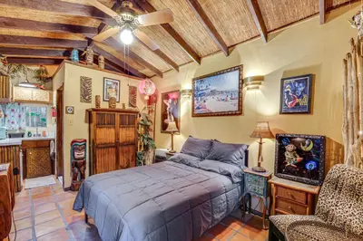 a bedroom with a bed and a chair in it at 2 Mi to Echo Park Funky Silver Lake Studio in Los Angeles