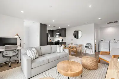 a living room with a couch and a table at Luxe 3BR South Bay - Comfort and Close to Beach in Harbor City