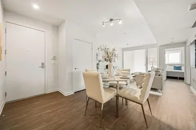 a dining room with a table and chairs at Heart of Santa Monica Chic Condo in Los Angeles