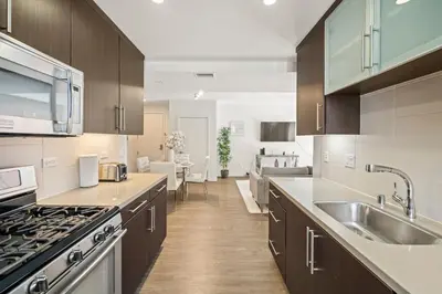 a kitchen with a sink and a stove at Heart of Santa Monica Chic Condo in Los Angeles