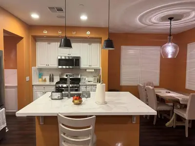 a kitchen with a large white table and chairs at Luxury 2 Bed 2 bath Home Near Six Flags in Santa Clarita
