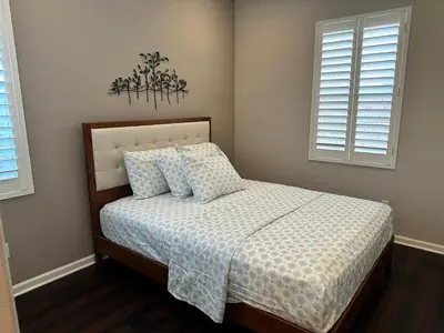 a bedroom with a bed and two windows at Luxury 2 Bed 2 bath Home Near Six Flags in Santa Clarita