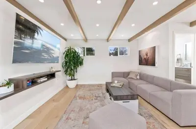 a living room with a couch and a table at Beautiful home with VIEWS in Silver Lake Hills in Los Angeles