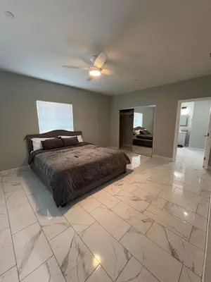 a bedroom with a bed and a ceiling fan at Welcome to A new updated 3 bedroom 2 Bath Home in California City