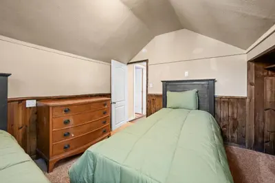 a bedroom with two beds and a wooden dresser at Appleview - Walk to Village/Lake, Lake View, Hot Tub, BBQ in Big Bear Lake