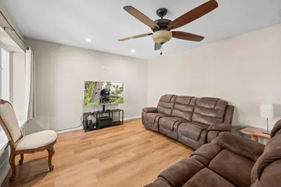 a living room with a couch and a ceiling fan at Appleview - Walk to Village/Lake, Lake View, Hot Tub, BBQ in Big Bear Lake