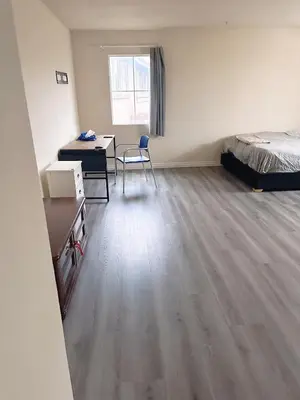 a room with a bed and a desk and a bed sidx sidx sidx at Big master bedroom private bathroom in Fontana