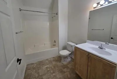 a bathroom with a sink and a toilet and a mirror at Woodland Oasis 2BR With FREE PARKING in Canoga Park