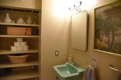 a bathroom with a sink and a mirror at Hollywood Hills Duplex with view and parking! in Los Angeles
