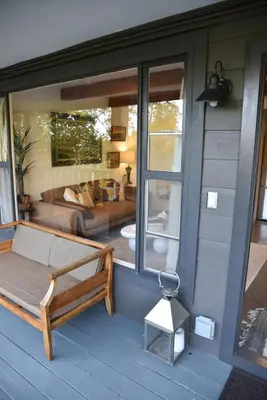 a porch with a bed and a living room at Hollywood Hills Duplex with view and parking! in Los Angeles