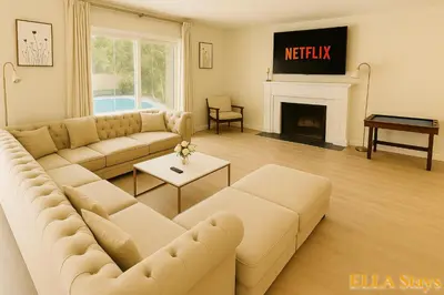a living room with a couch and a fireplace at Rowland Heights Cozy & Quiet Home in Rowland Heights