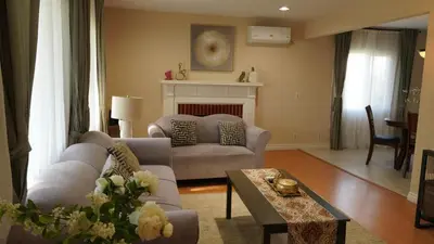 a living room with a couch and a fireplace at \u6c11\u5bbf\u963f\u5c14\u7f55\u5e03\u62c9666 in Alhambra