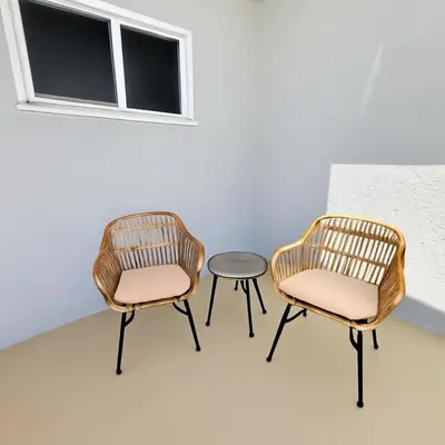 two chairs and a table in a room at Stunning Oasis with Pool by Disneyland and Knotts in Buena Park