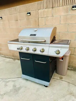 a barbecue grill sitting on top of a trash can at Stunning Oasis with Pool by Disneyland and Knotts in Buena Park