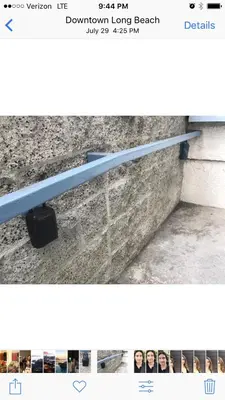 a picture of a blue rail on a wall at Ocean Condo Penthouse with Gym & Parking in Long Beach