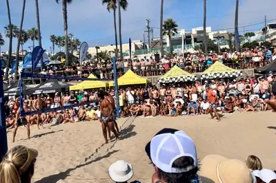 a crowd of people watching a volleyball game on a beach at Ocean View Penthouse 2 Bdrm 2 Bath w garage 2 Blocks to sand in Manhattan Beach