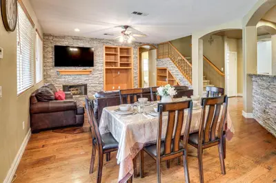 a dining room with a table and chairs at Pool, Patio and Games! Suburban Home in Palmdale in Palmdale